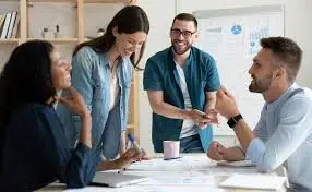 Team of professionals having a collaborative discussion in a modern workspace.